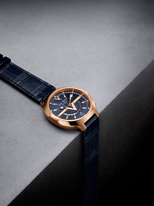 The Louis Vuitton GMT 18k pink-gold version with an anthracite dial